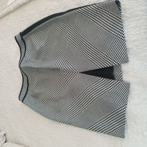 White House Black Market skirt side zip.  Black trim on each side and top detail